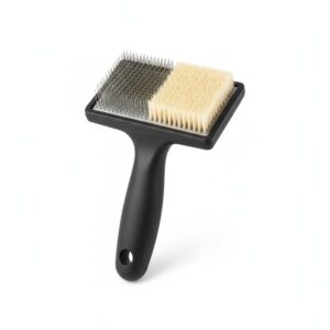 Double-sided slicker and bristle brush on a white background